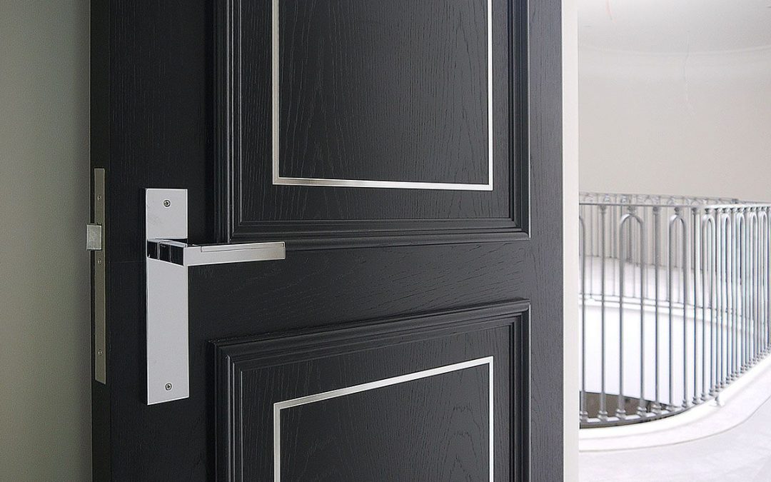 open black internal wooden door leading to the hallway