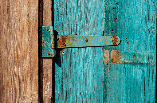 How do you repair a crack in a wooden door?